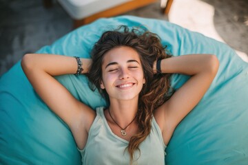 Fototapeta premium Smiling Woman Enjoys Summer Relaxation on Patio in Comfy Bean Bag Chair