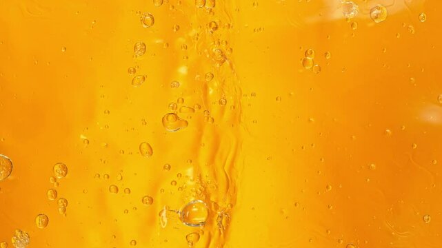 Super Slow Motion Shot of Golden Oil Waving in Water at 1000fps.