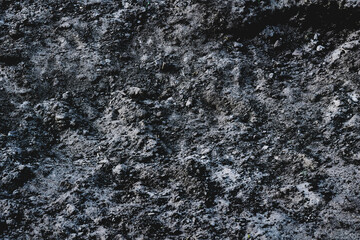 Ground.Black pile of fertile soil for adding to lawns