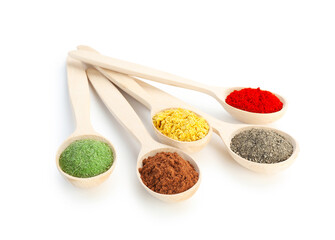 Different aromatic spices in spoons isolated on white