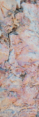 Large vertical shot of rough background of rock texture in pinkish tones.Ideal for use in design, 3D modeling, game environments, and architectural backgrounds.High quality. Copy space. 