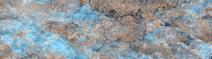 High-resolution natural stone surface with deep cracks and erosion patterns.Perfect for cinematic backdrops, fantasy landscapes, and environmental concept. Copy space
