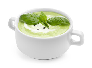 Tasty pea cream soup with basil isolated on white