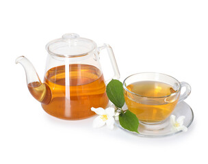 Aromatic jasmine tea in glass cup, teapot and flowers isolated on white