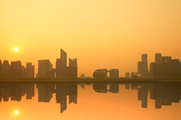 Fototapeta premium Hangzhou Qianjiang New City skyline and reflection under the sunset
