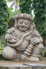 Closeup front view of ancient giant monolith statue of dvarapala or guardian protector of Singhasari palace, Singosari, Malang, East Java, Indonesia
