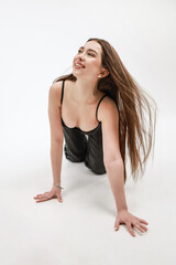 Beautiful girl with flying hair on a white background.