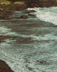BALI, INDONESIA Beach and breaking Indian Ocean waves, Bali. Tanah Lot Temple