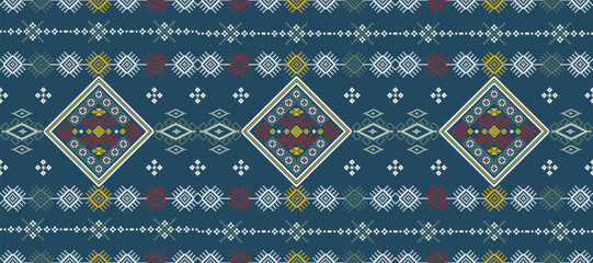 Traditional geometric textile pattern with diamond shapes and intricate symmetrical designs in blue, red, white, and yellow colors.