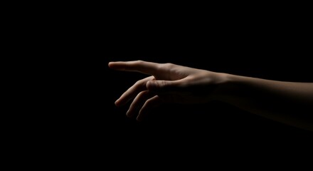 Hand Reaching Out in Darkness Dramatic Lighting Concept for Connection