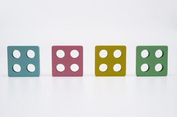 Minimal composition with vibrant square shapes symbolizing order and structure.Four colorful...