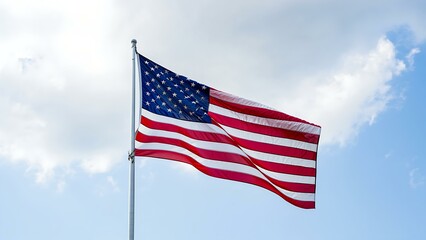 American Flag Waving in the Wind Against Blue Sky