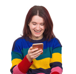Cheerful woman wearing a colorful sweater holding smartphone browsing social media with a smile on her face, positive emotions. Modern technology artificial intelligence and virtual services network