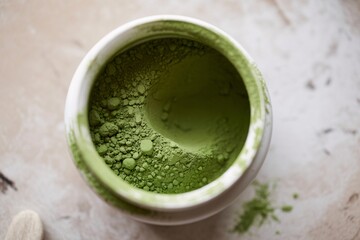 Close-up of Matcha Green Tea Powder in a White Container