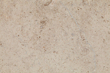 White and tan stone wall with a few small cracks
