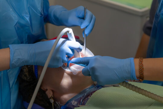 Woman receiving dental treatment in a clinic with expert care and technology - Powered by Adobe