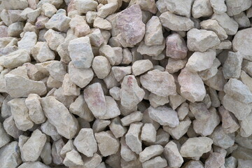 Close-up of angular crushed stones or chippings used for construction, pathways, driveways, and decorative purposes. Durability and landscaping, stabilizing areas with heavy traffic or footfall