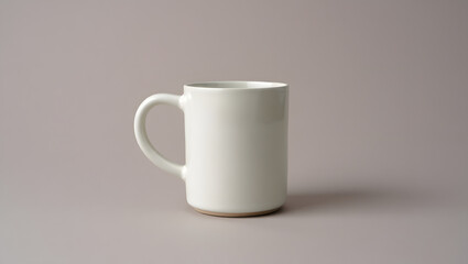 Fototapeta premium A simple offwhite ceramic mug sits on a neutral beige background