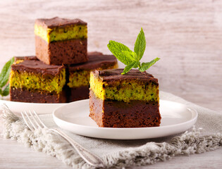 chocolate cake slices with pistachio and kadayif layer