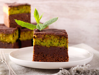 chocolate cake slices with pistachio and kadayif layer