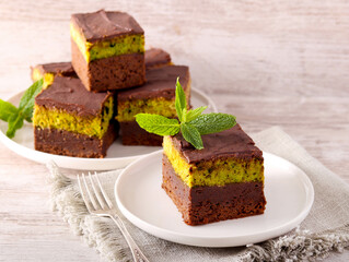 chocolate cake slices with pistachio and kadayif layer