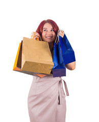 Positive thinking redhead woman holding shopping bags to cheeks, looking away dreaming and imagining isolated on transparent background with copy space