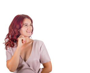 Pensive redhead woman keeps hand under chin thoughtful looking aside, finding solutions to her questions
