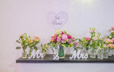 Wedding decor. Close up of a wedding table decoration with white and pink flowers and candles Wedding floristic concept