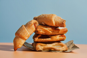 Fresh sweet pastries on a blue background