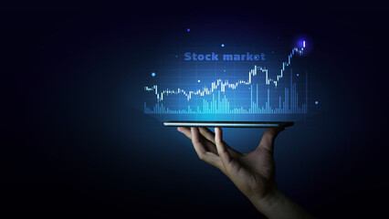 Futuristic representation of the stock market displayed on a tablet, showing growth graphs and analytics, symbolizing modern technology and global trading insights in a sleek, illuminated design.