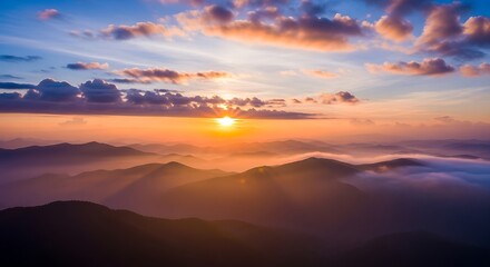 Sunrise Over Mountain Range with Clouds and Golden Light