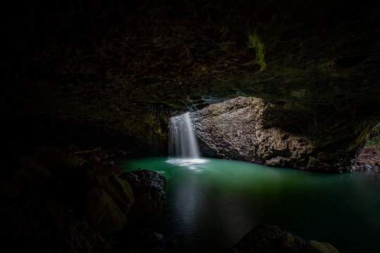 Natural Bridge with waterfall into cave