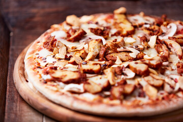 Gyros Pizza with with champignons and mozzarella cheese. Wooden background. Soft focus.