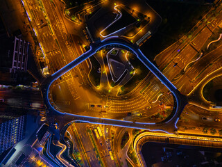 Aerial View of City Crossroads with heavy traffic in Shanghai at night.