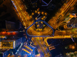 Aerial View of City Crossroads with heavy traffic in Shanghai at night.