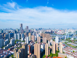 Aerial view of Shanghai skyscraper in downtown with blue sky background.