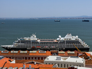 A large beautiful liner is moored in the port of Lisbon, Portugal in the Atlantic Ocean	
