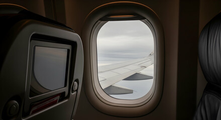 Window view of airplane wing: safe travel and safety airplane concept