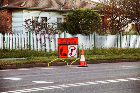 Water Main under repair sign on the roadside