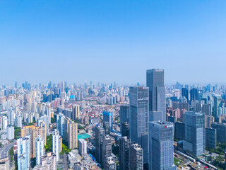 Aerial view of Shanghai skyscraper in downtown with blue sky background.