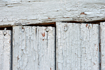 Old Shabby Wooden Planks with cracked gray Paint. wooden, retro, vintage background. old cracked paint on wooden boards. close-up, macro photo. cracks, rough, old paint peeling off