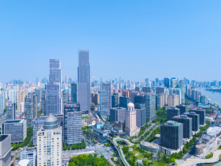 Aerial view of Shanghai skyscraper in downtown with blue sky background.
