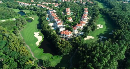Aerial view of beautiful villas and golf course at Mission Hills Shenzhen resort during the daytime