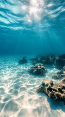 The sun's rays penetrating the water create a magical atmosphere of the underwater world. Suitable for articles about sea voyages and explorations.