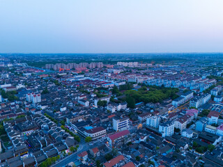 Fototapeta premium Aerial view of Shanghai Xinchang Ancient Town at sunset, One of the most famous ancient towns in Shanghai.