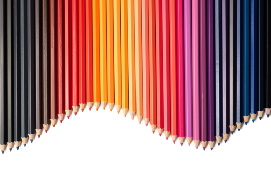 The Photo of colorful colored pencils arranged in a curved line pattern on a white background.