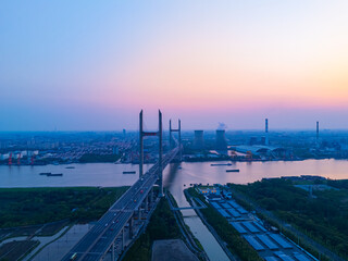 Aerial view of cars on MinPu bridge, The background is a Coal-fired power generation, Shanghai