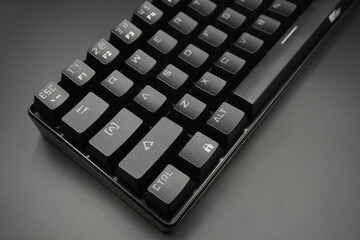 A black mechanical keyboard with a black background