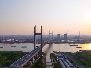 Aerial view of cars on MinPu bridge, The background is a Coal-fired power generation, Shanghai
