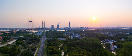 Aerial view of cars on MinPu bridge, The background is a Coal-fired power generation, Shanghai